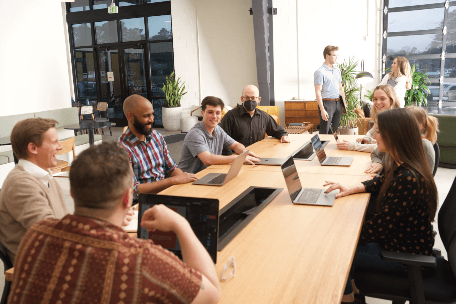 The HIFI Agency team collaborating around a conference table